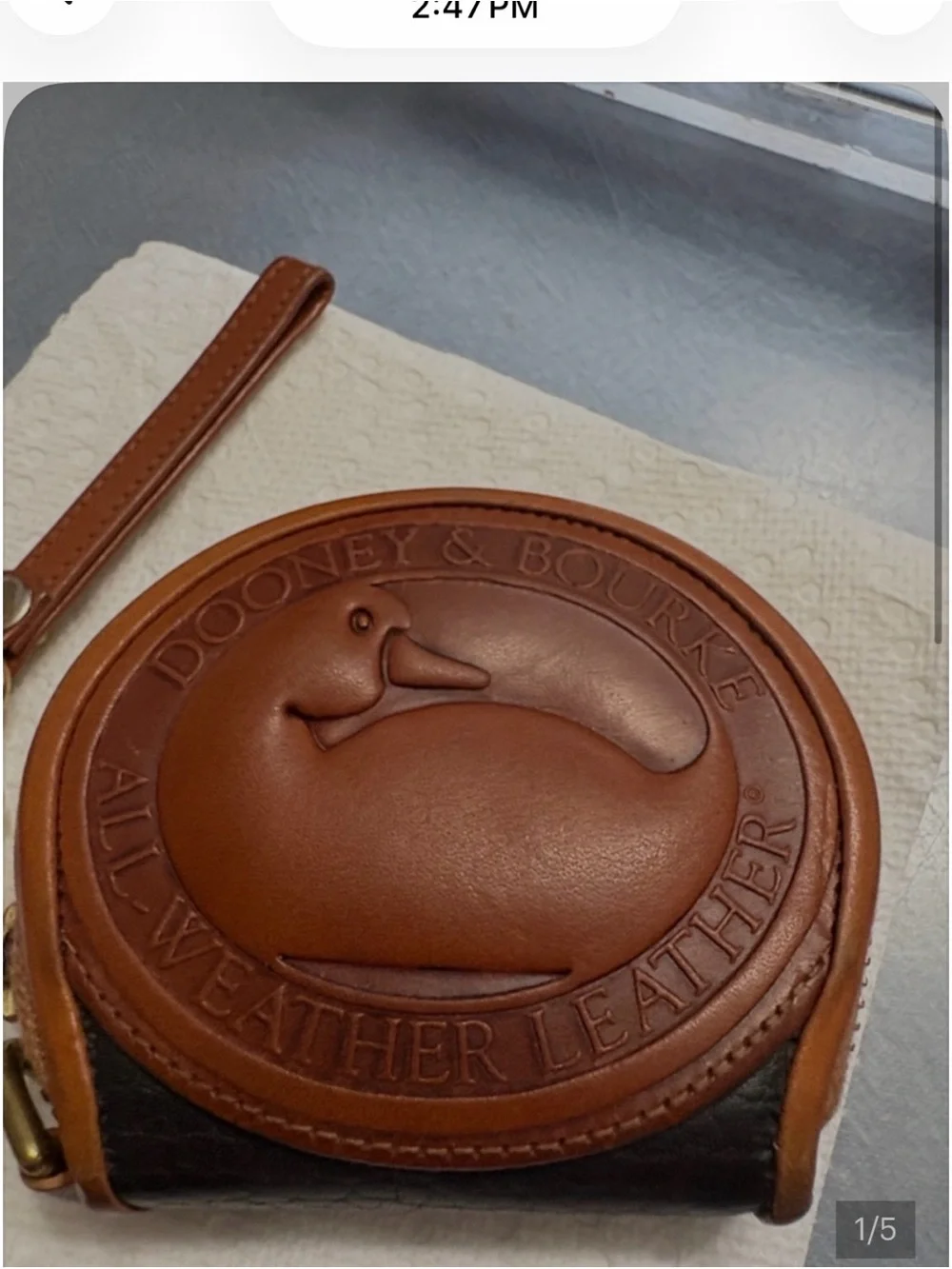 Dooney & Bourke Embossed Round Leather Wristlet in Cognac